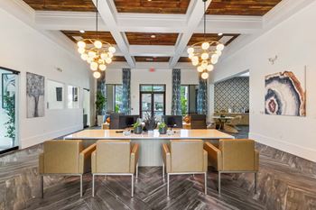 A conference room with a long table and chairs.